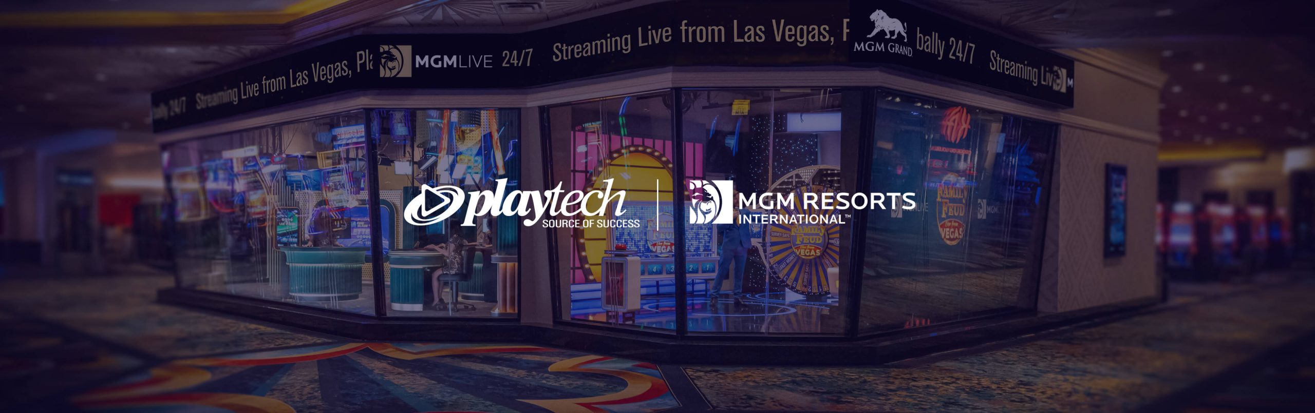 Glass-walled MGM Grand studio with the Family Feud stage and original Playtech and MGM Resorts branding