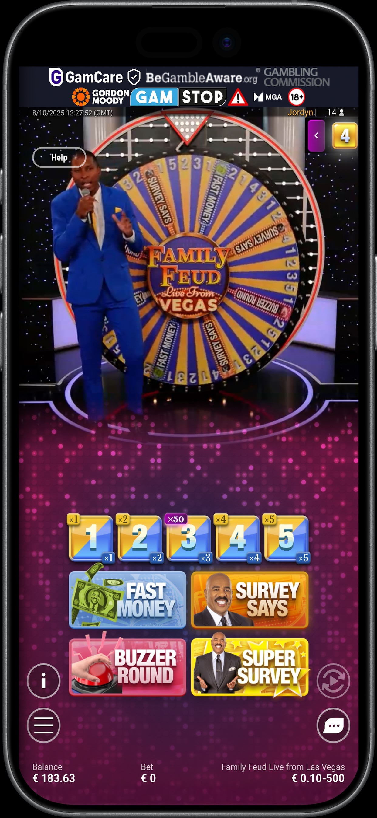 Paddy Power Live Casino publisher preview showing a live Family Feud game presenter, wheel, game controls and responsible-gambling header within a phone frame.